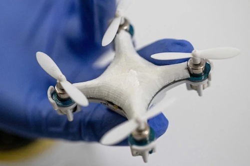 Image of a hand holding a drone